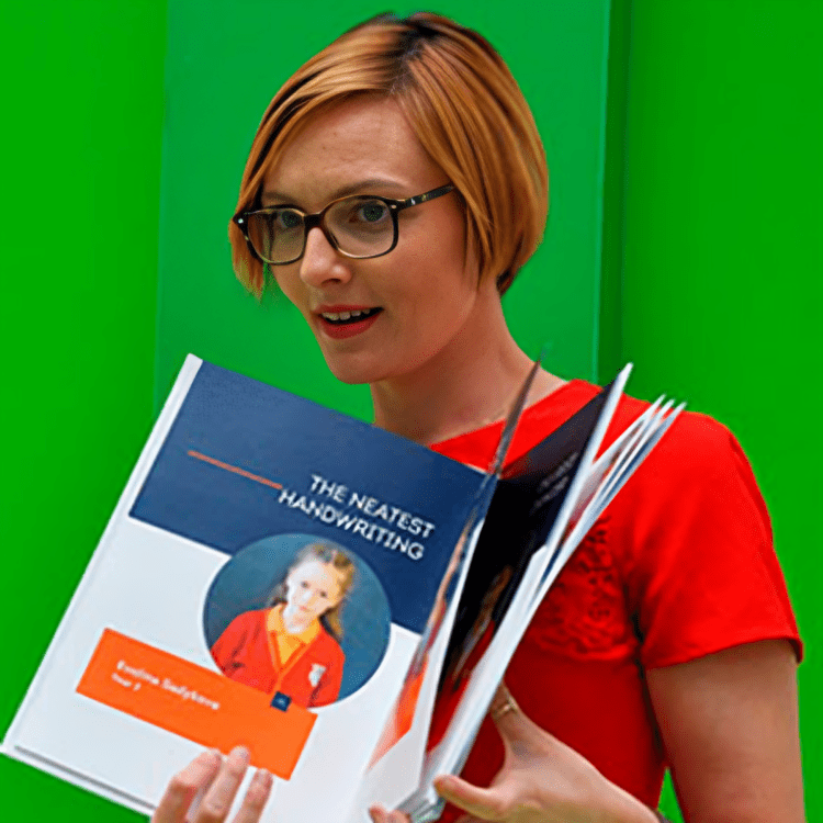 Person with glasses reading book