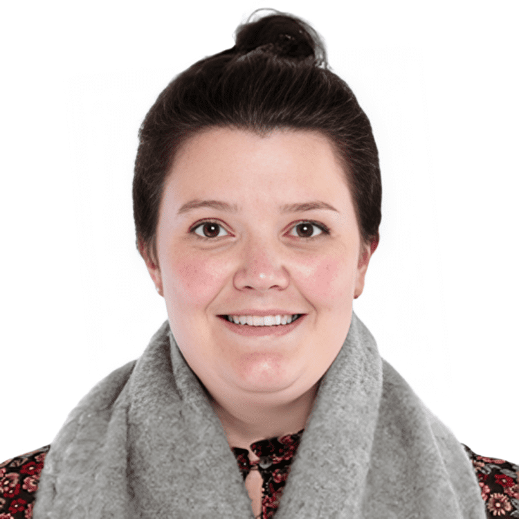 Smiling person with a gray scarf